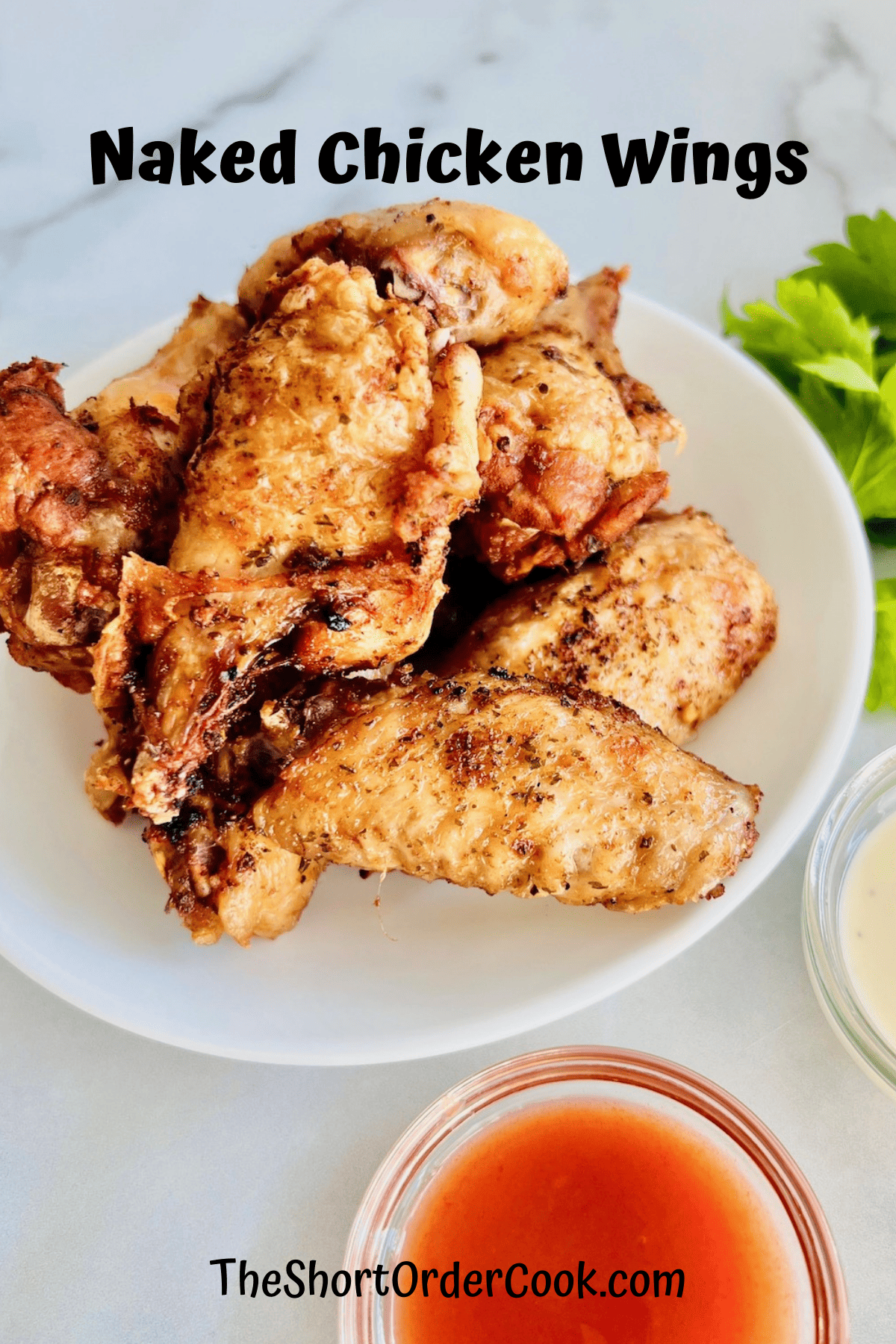 Plain naked chicken wings cooked on a plate. 