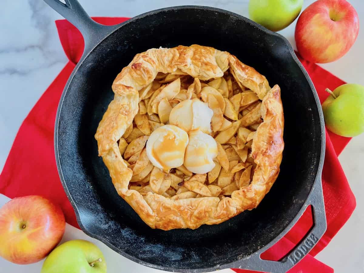 Puff Pastry Apple Galette baked in a cast iron skillet and ready to serve.