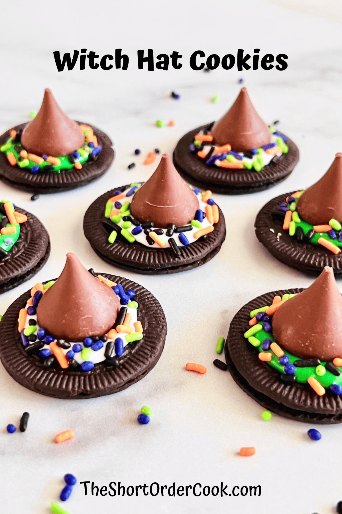 Witch hat cookies made from Oreo thins and hershey kisses.