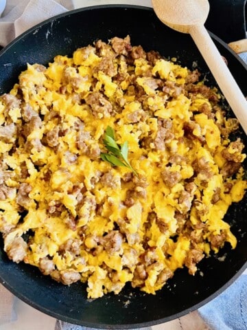 Breakfast Sausage, Egg, & Cheese Scramble in a skillet with a serving spoon.