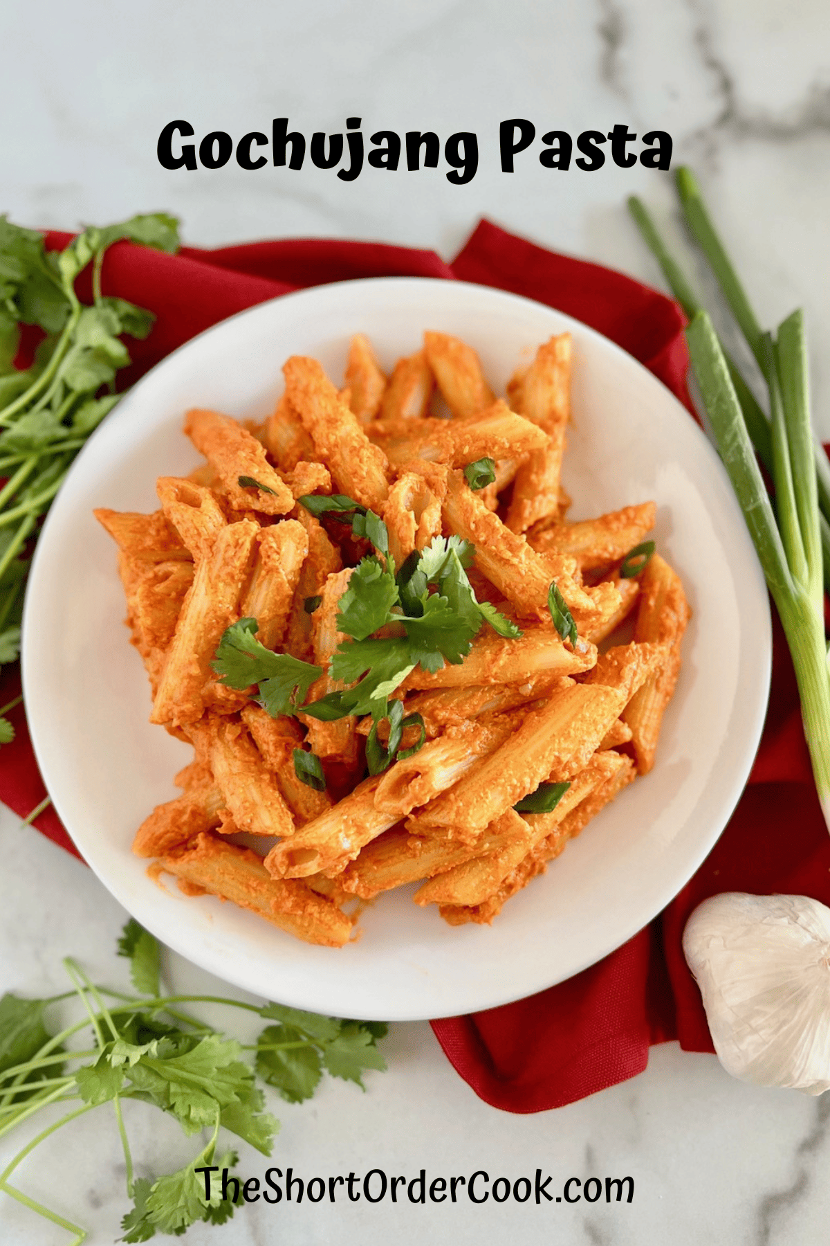 Pasta with gochujang and cheese sauce on a plate.