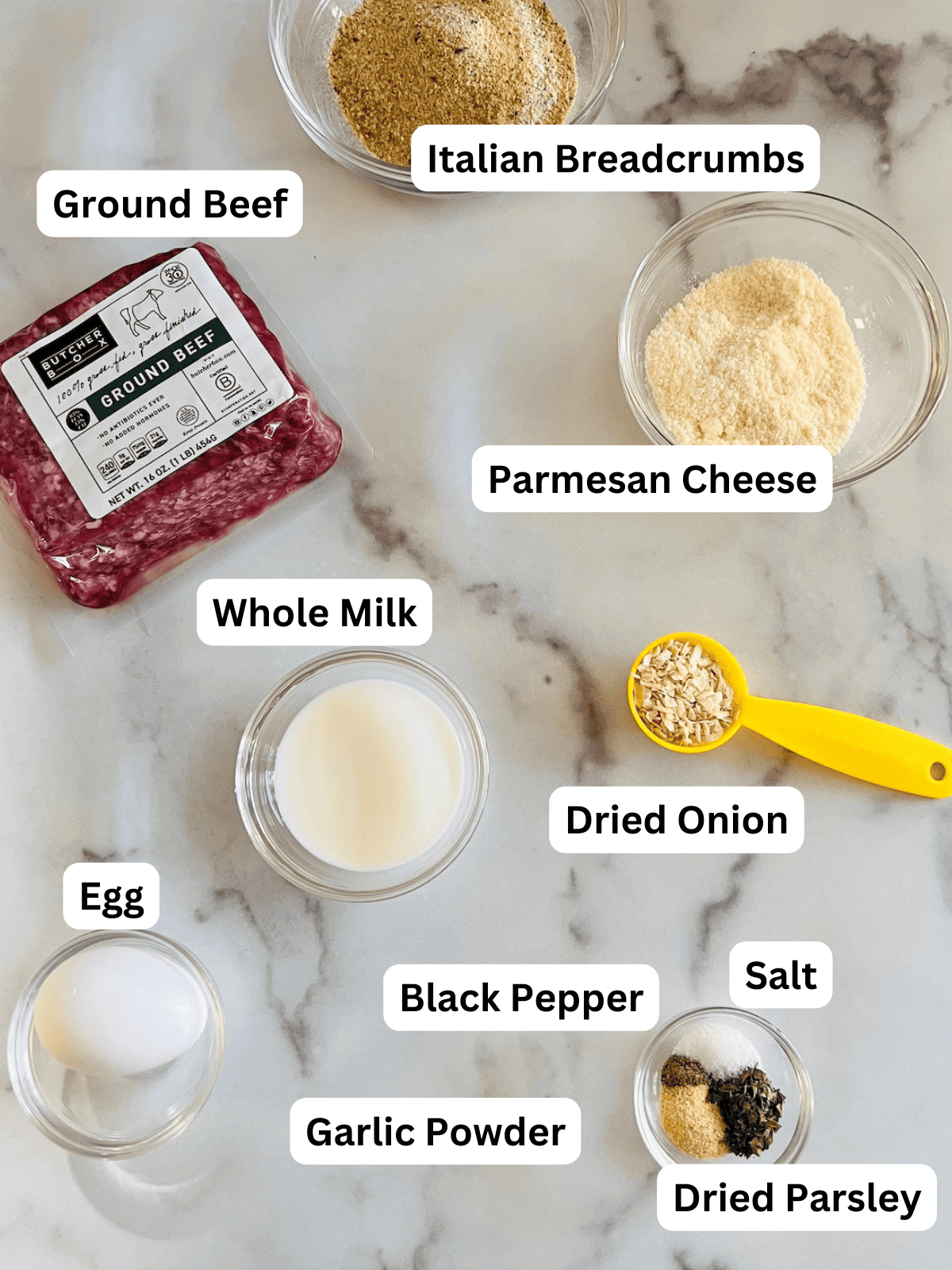 Ingredients to make beef meatballs on the counter.