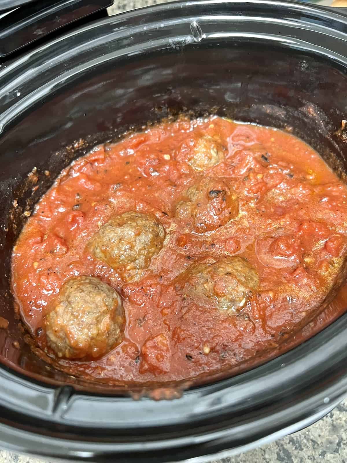Slow Cooker Italian Meatballs & Sauce Meatballs ready to cook in sauce.