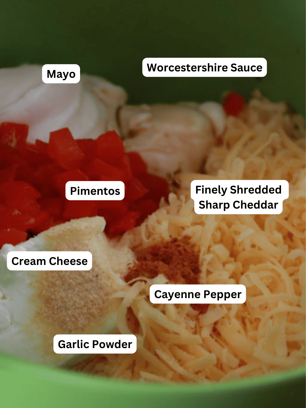 Ingredients for homemade pimento cheese dip in a mixing bowl.