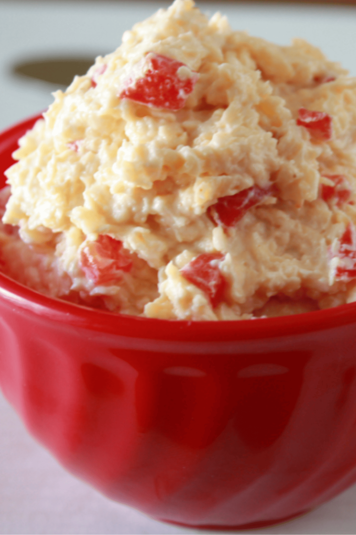 Bowl overflowing with pimento cheese.