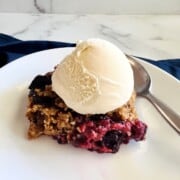 Berry Crisp with Steel Cut Oats topped with vanilla ice cream.
