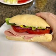 Mortadella sandwich on ciabatta with sliced tomatoes & romaine.