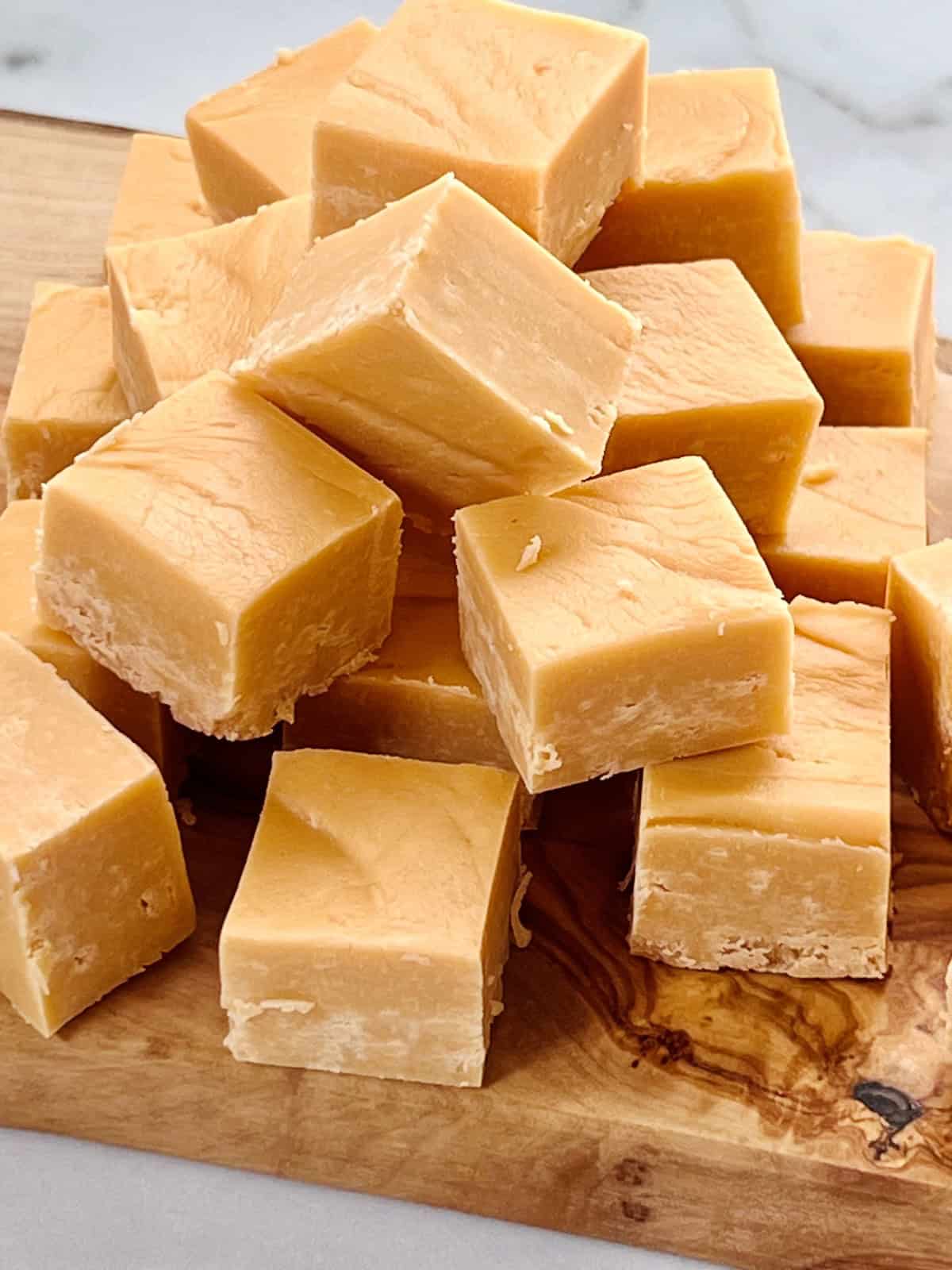 Butterscotch Fudge Ready to serve candy squares piled on a dessert board.