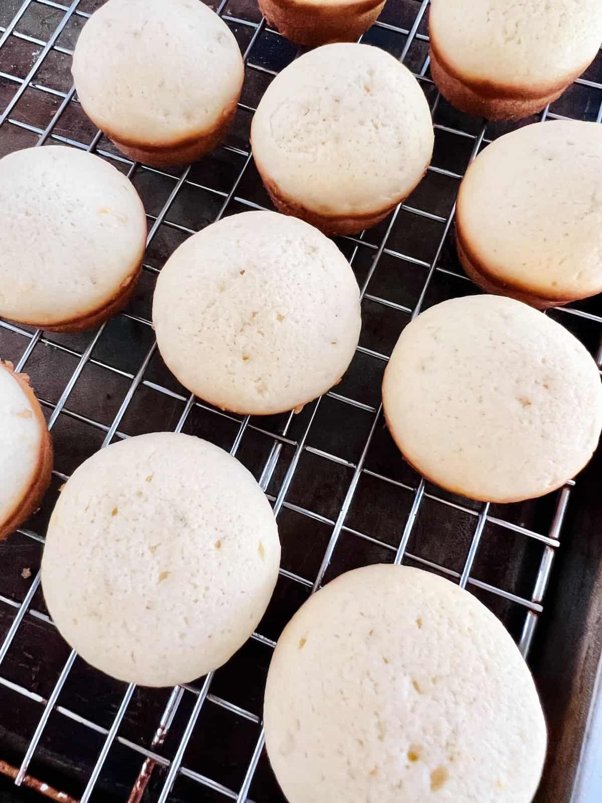 Mini Lemon Muffins Cooling on wire rack.