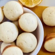 Fresh baked mini lemon muffins in a bowl.