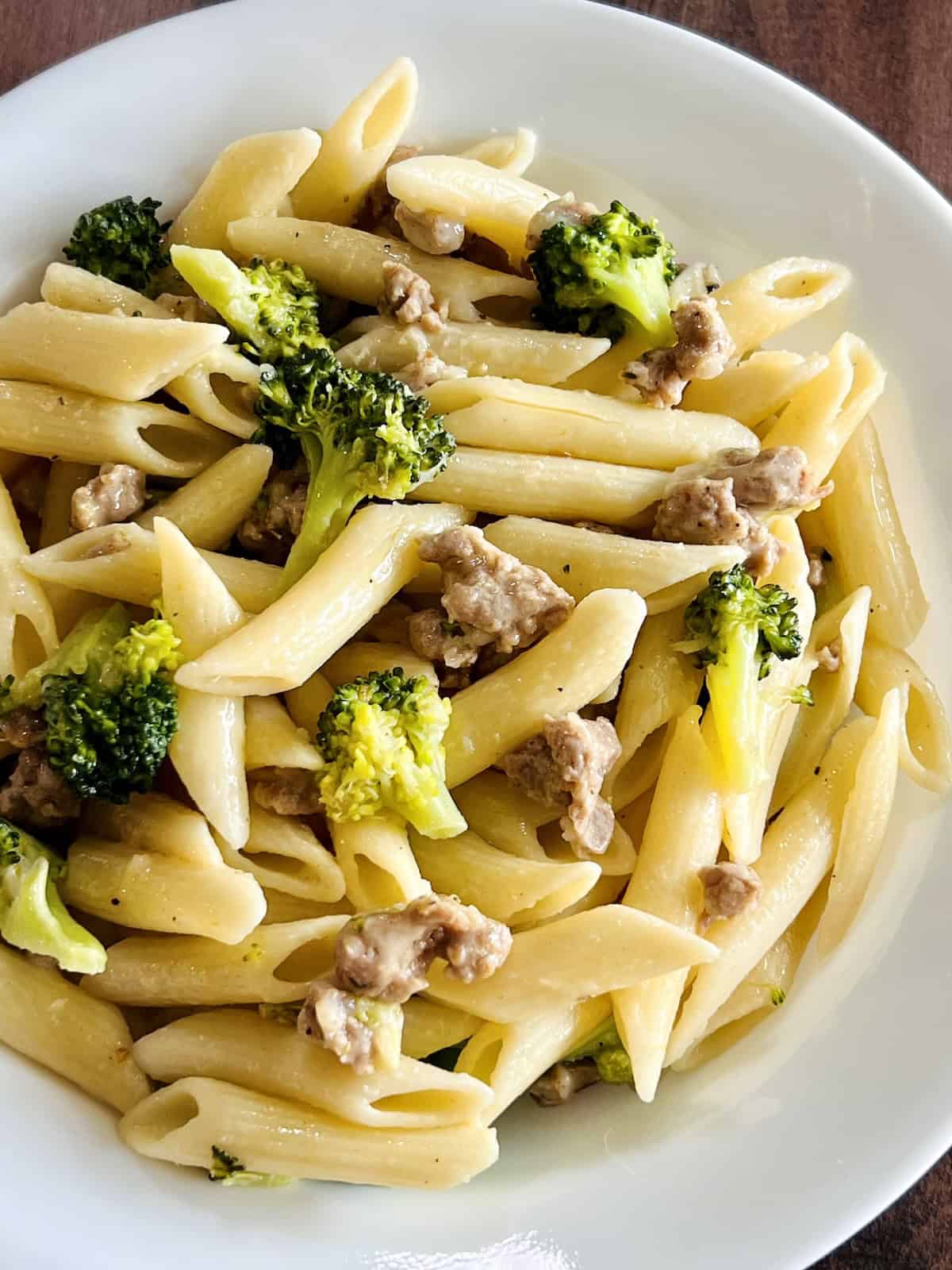 Bowl of Italian Sausage and Broccoli penne Pasta with parmesan.