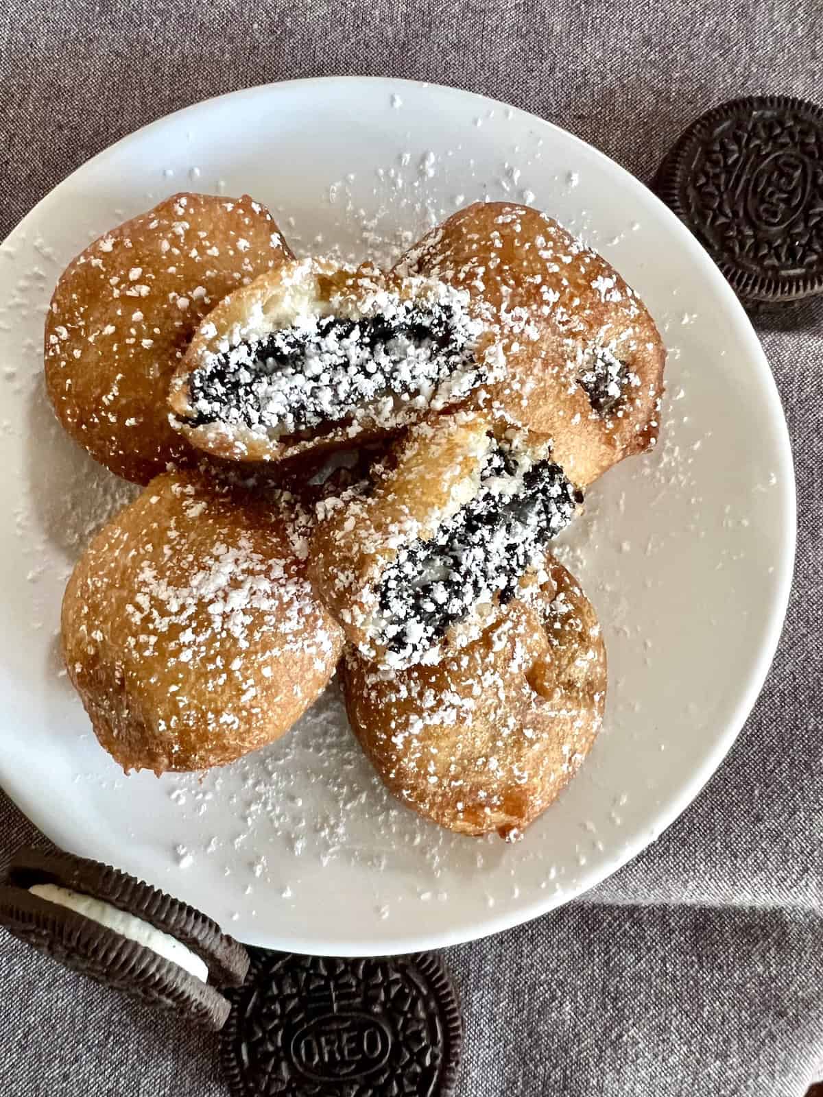 Deep Fried Oreos Plated dusted with powdered sugar.