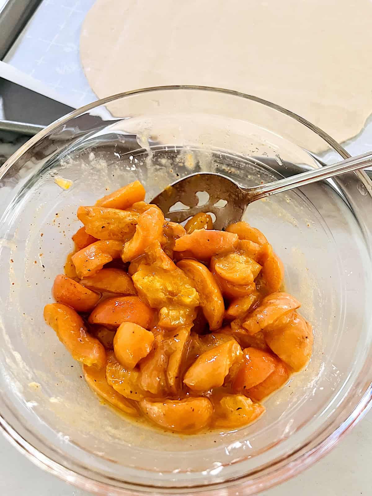 Fruit filling with sugar cornstarch and nutmeg in a bowl,