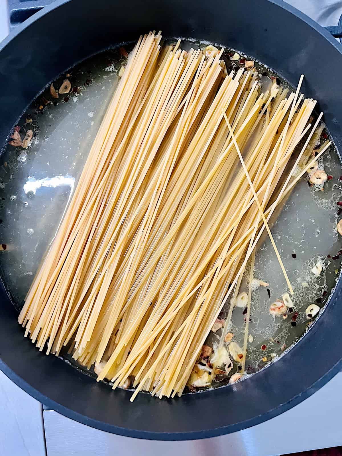 One Pot Lemon Butter Pasta (Pasta al Limone Raw pasta added to broth lemon juice and garlic.