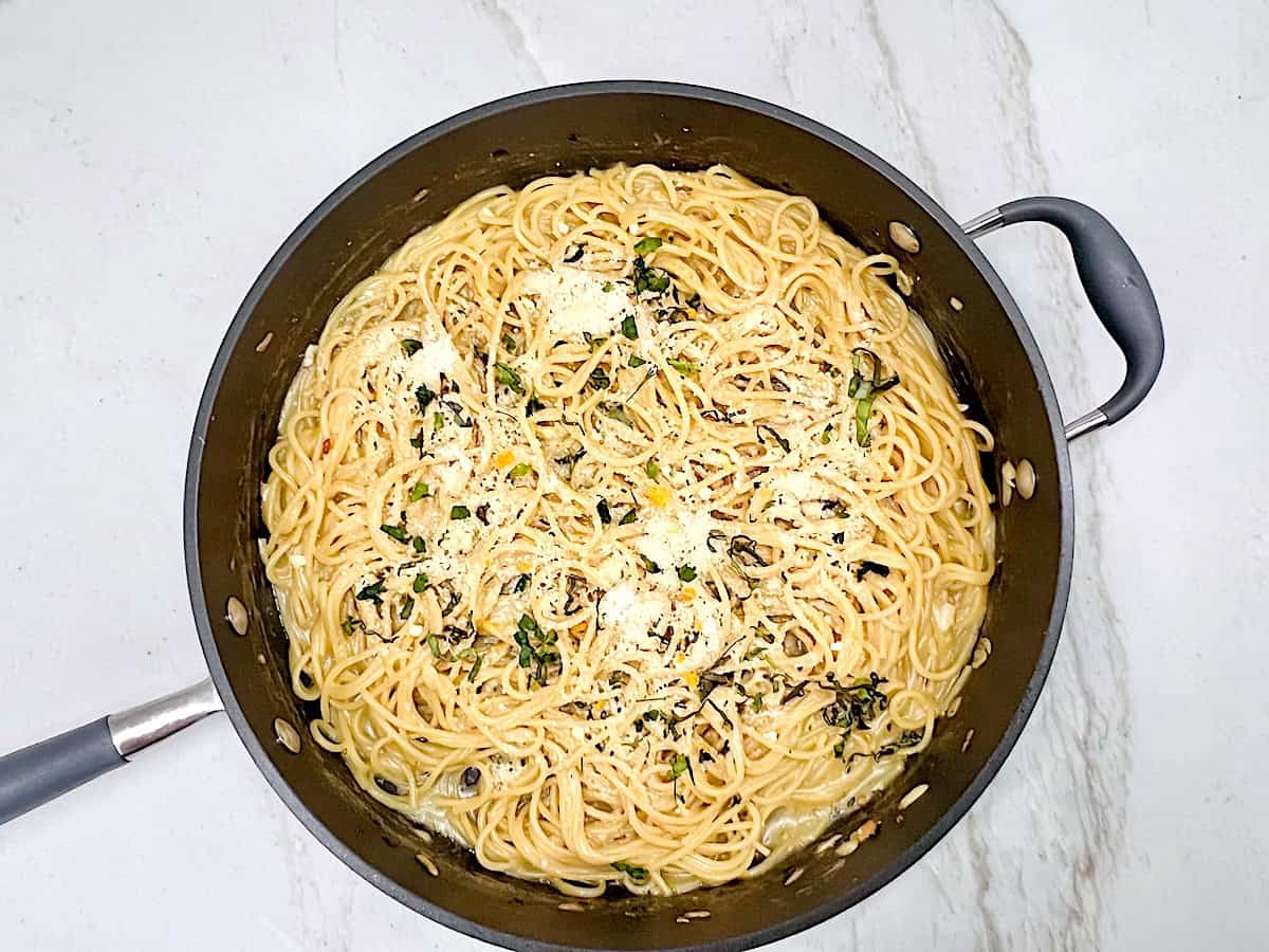 One Pot Lemon Butter Pasta (Pasta al Limone) in the pan topped with parmesan ready to serve.
