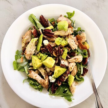 Arugula Salad with Leftover grilled BBQ Chicken, cheese, nuts, and avocado.