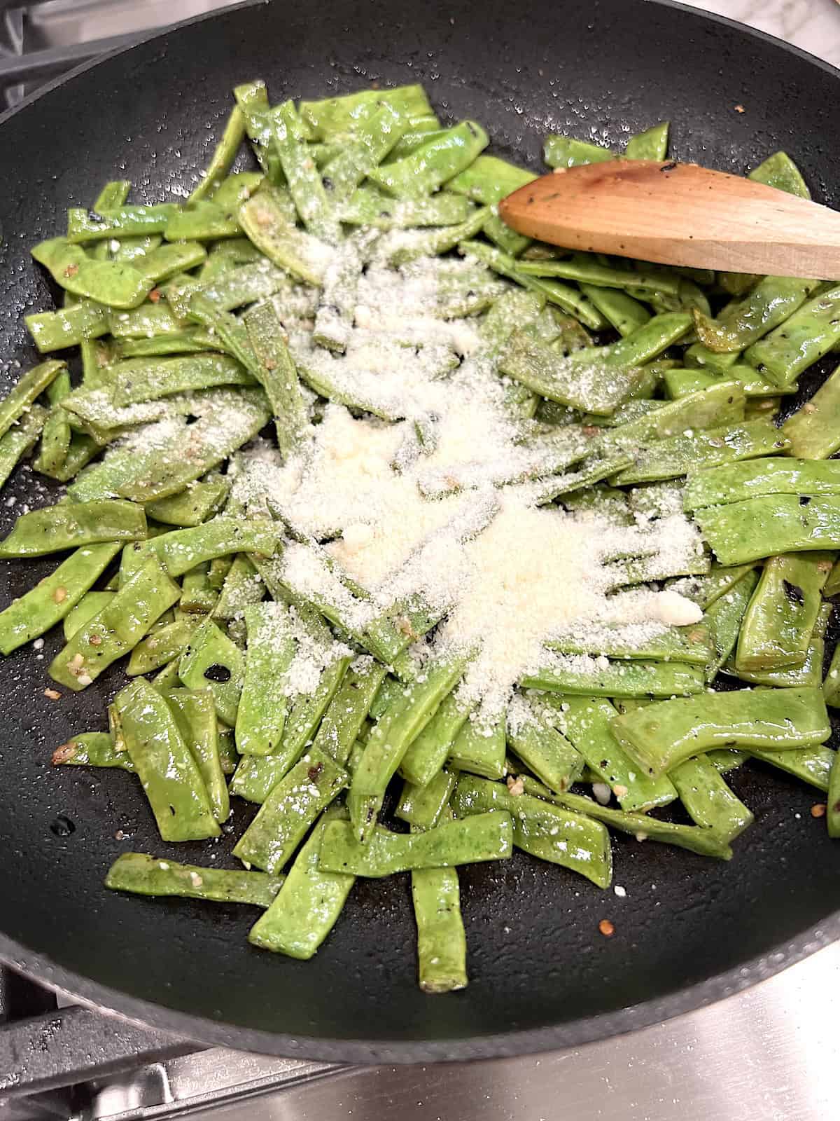 Garlic Sauteed Romano Beans Adding optional parmesan cheese.