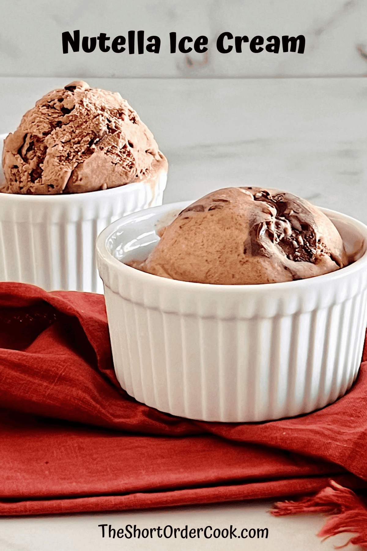 Scoops of ice cream with Nutella swirls in bowls.