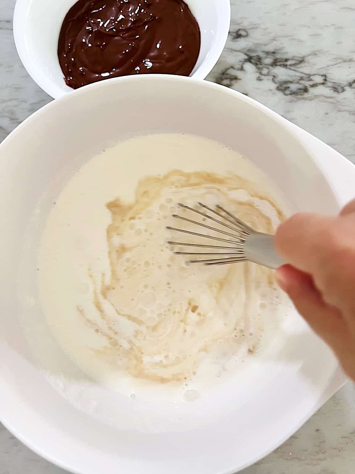 Whisk ingredients in bowl to make vanilla ice cream base before adding Nutella.