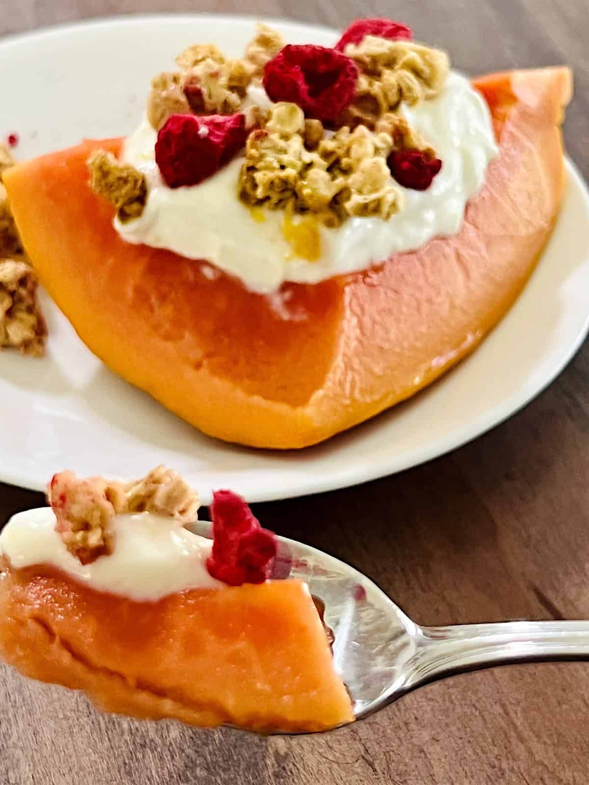 Papaya Yogurt Boats Spoonful up close.