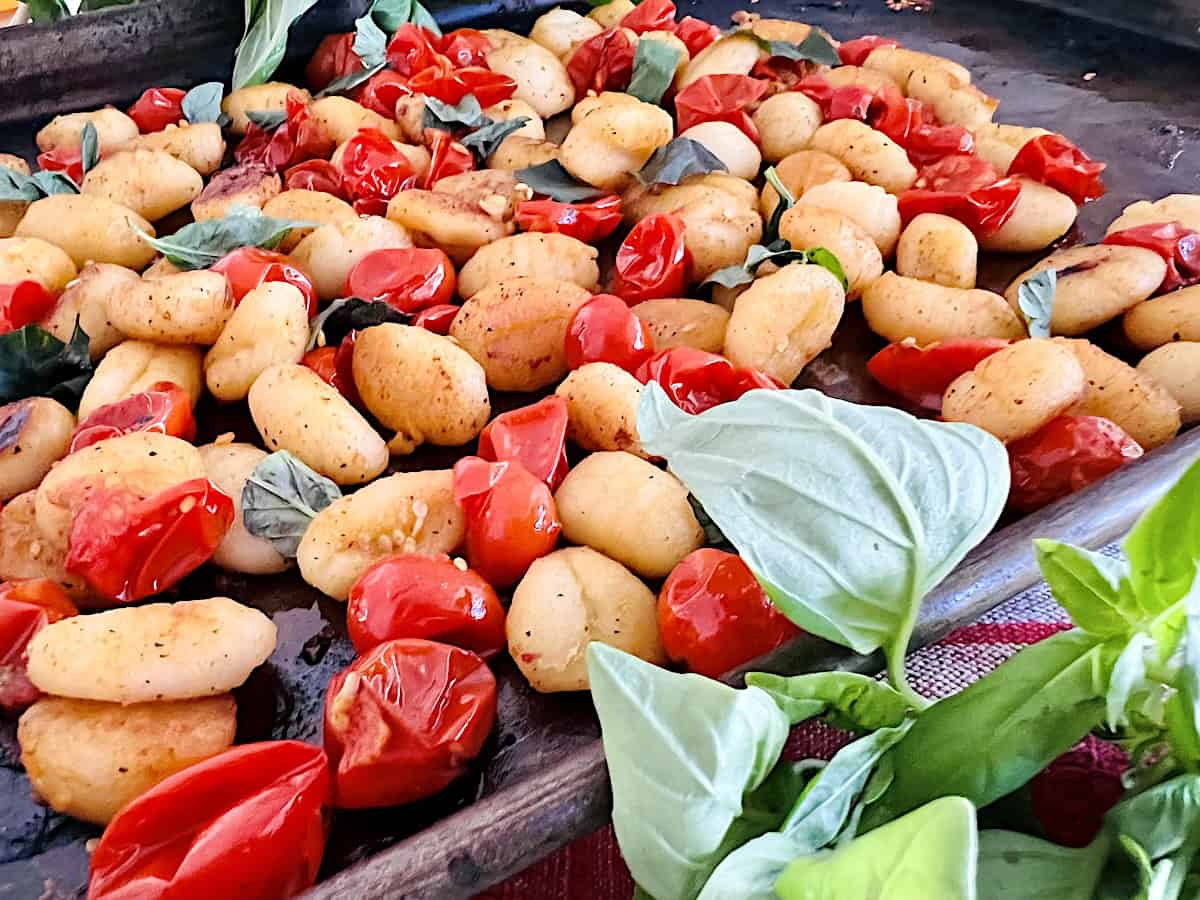 Baked Sheet Pan Cherry Tomato and fresh Basil Crispy Gnocchi meal.