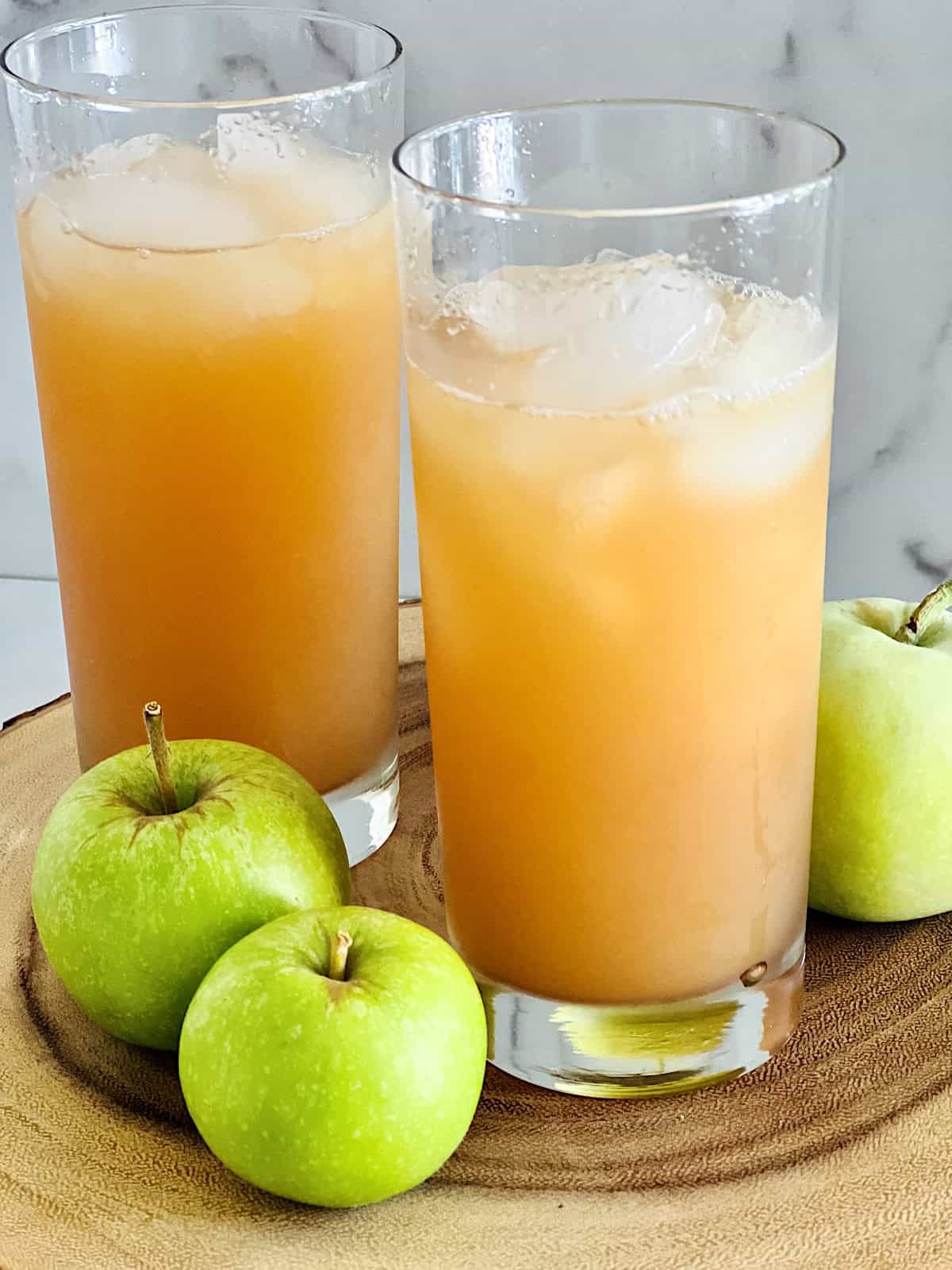 Spiced Apple Cider Mocktail Best fall non alcoholic Recipe in two tall glasses over ice