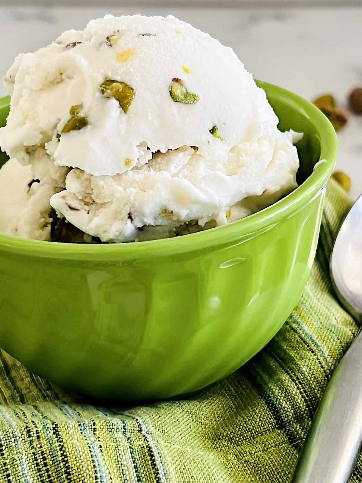Pistachio Ice Cream Closeup up scooped in a bowl.