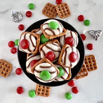 Christmas Pretzel and M&M candy treats stacked ready to eat.