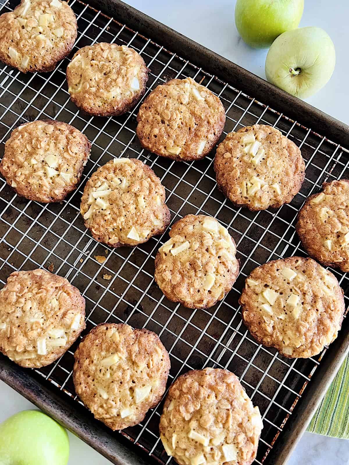 Soft and Chewy Apple Oatmeal Cookies Cooling on a rack.