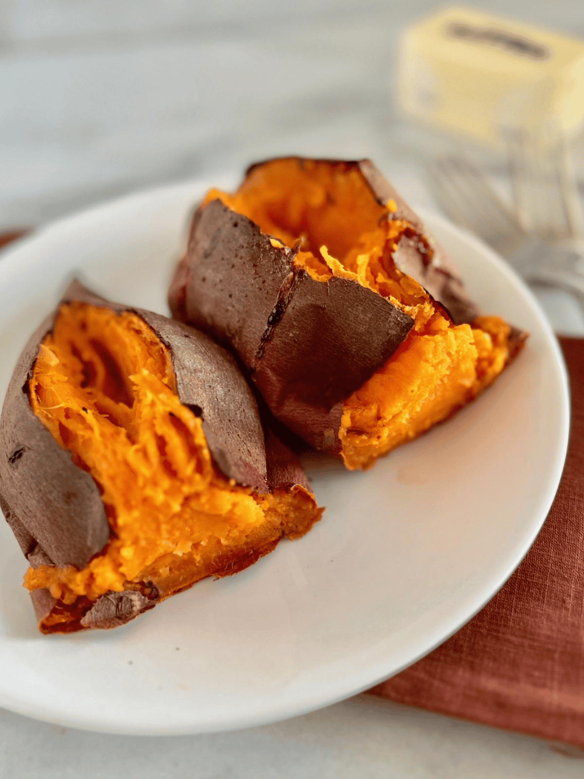 How Long to Bake Sweet Potatoes at 400 Cut open and ready to eat with butter