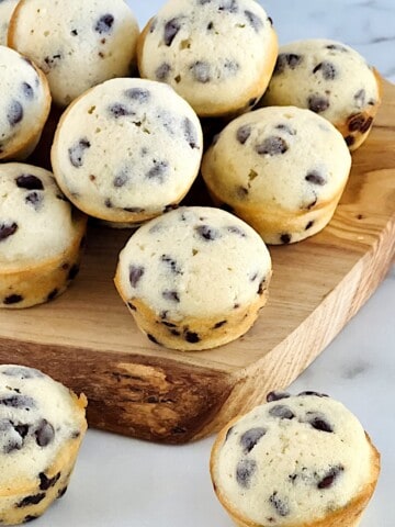 Mini Chocolate Chip Muffins Featured on a serving board for breakfast.