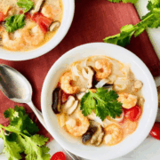Homemade Tom Yum Soup with Noodles shrimp coconut milk and vegetables.