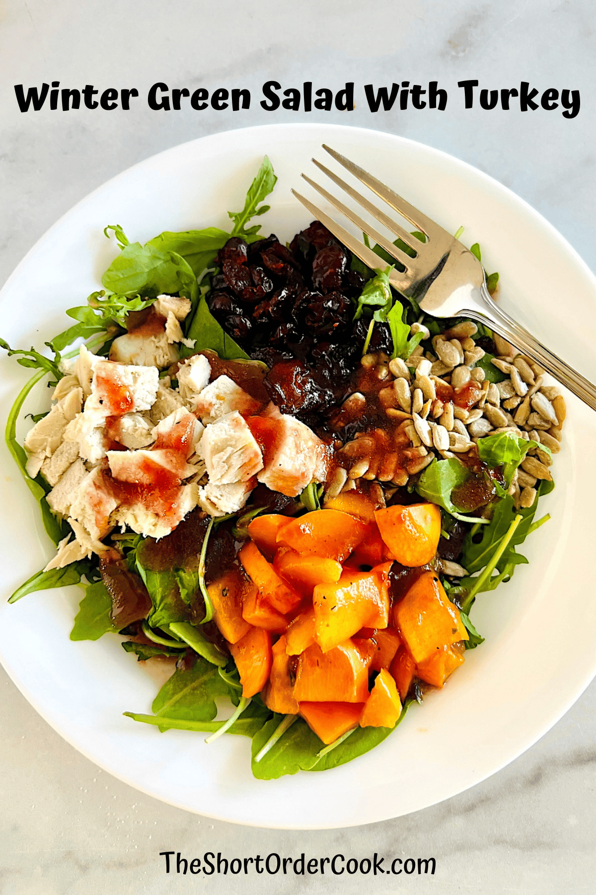 Winter Green Salad With Diced Turkey, fruit, & homemade vinaigrette.