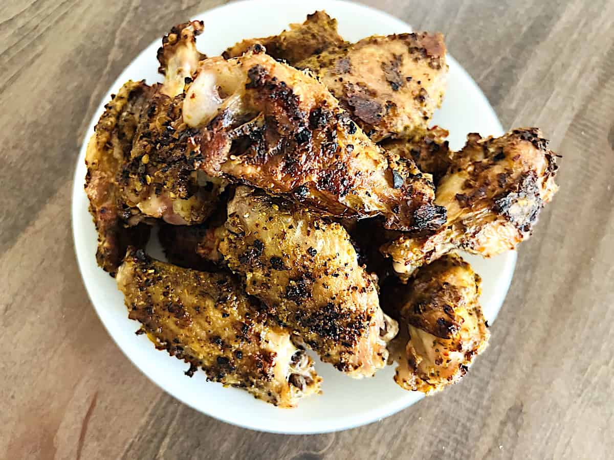 How to Cook Chicken Wings in the Oven Recipe ready to eat on a plate.