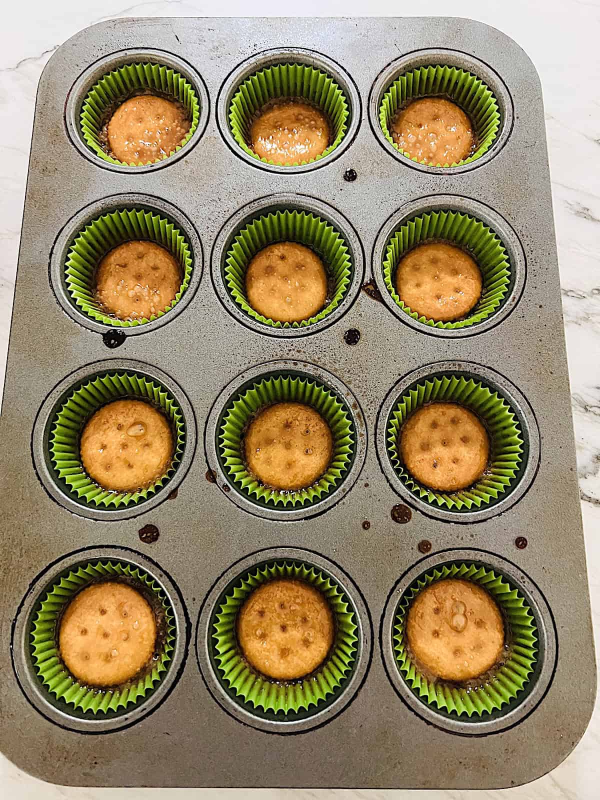 Crack Cookies fresh out of the oven in the muffin tin before adding chocolate.