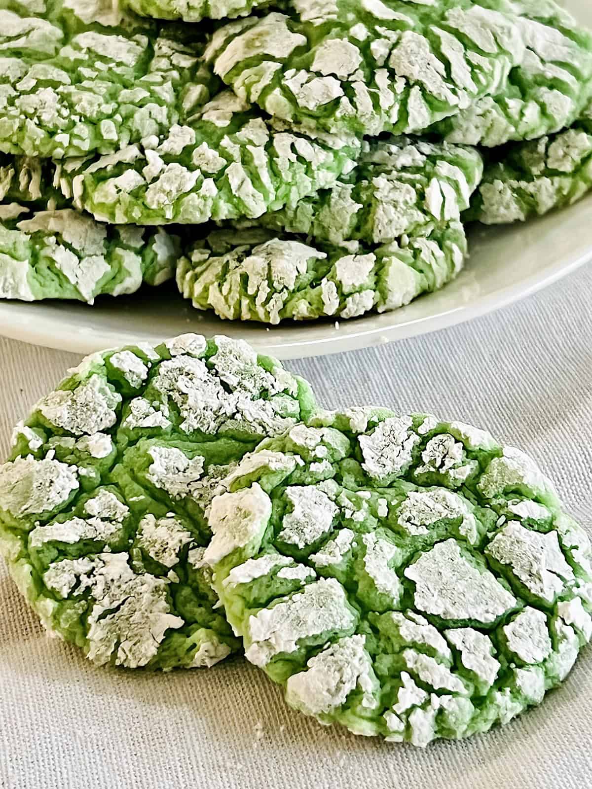 Green Cake Mix Crinkle Cookies Best recipe on a plate ready to serve for St Patrick's Day dessert.
