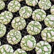 Festive holiday Green Cake Mix Crinkle Cookies on a rack cooling