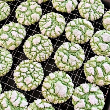 Festive holiday Green Cake Mix Crinkle Cookies on a rack cooling