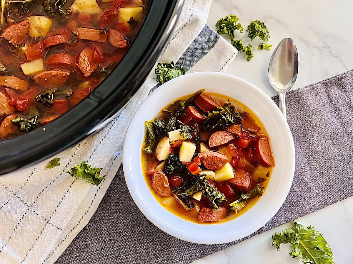 Slow Cooker Sausage Kale Soup Best recipe in a bowl and the rest in the Crockpot.