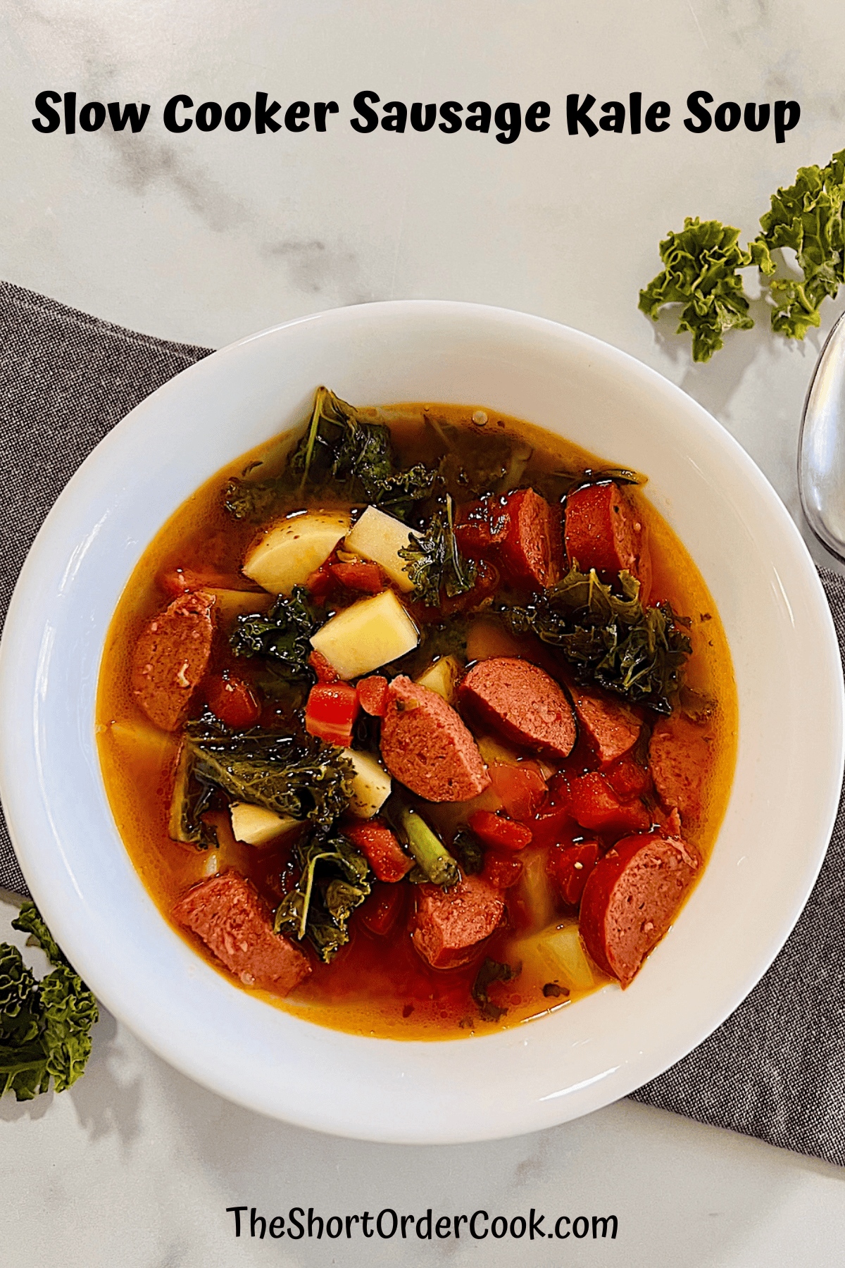 Bowl of sausage kale potato soup made in the CrockPot.