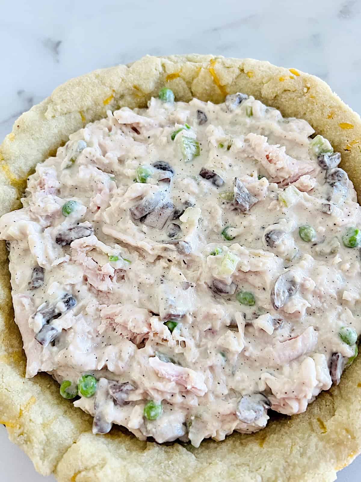 Keto Chicken Pot Pie Filling added to bottom crust.