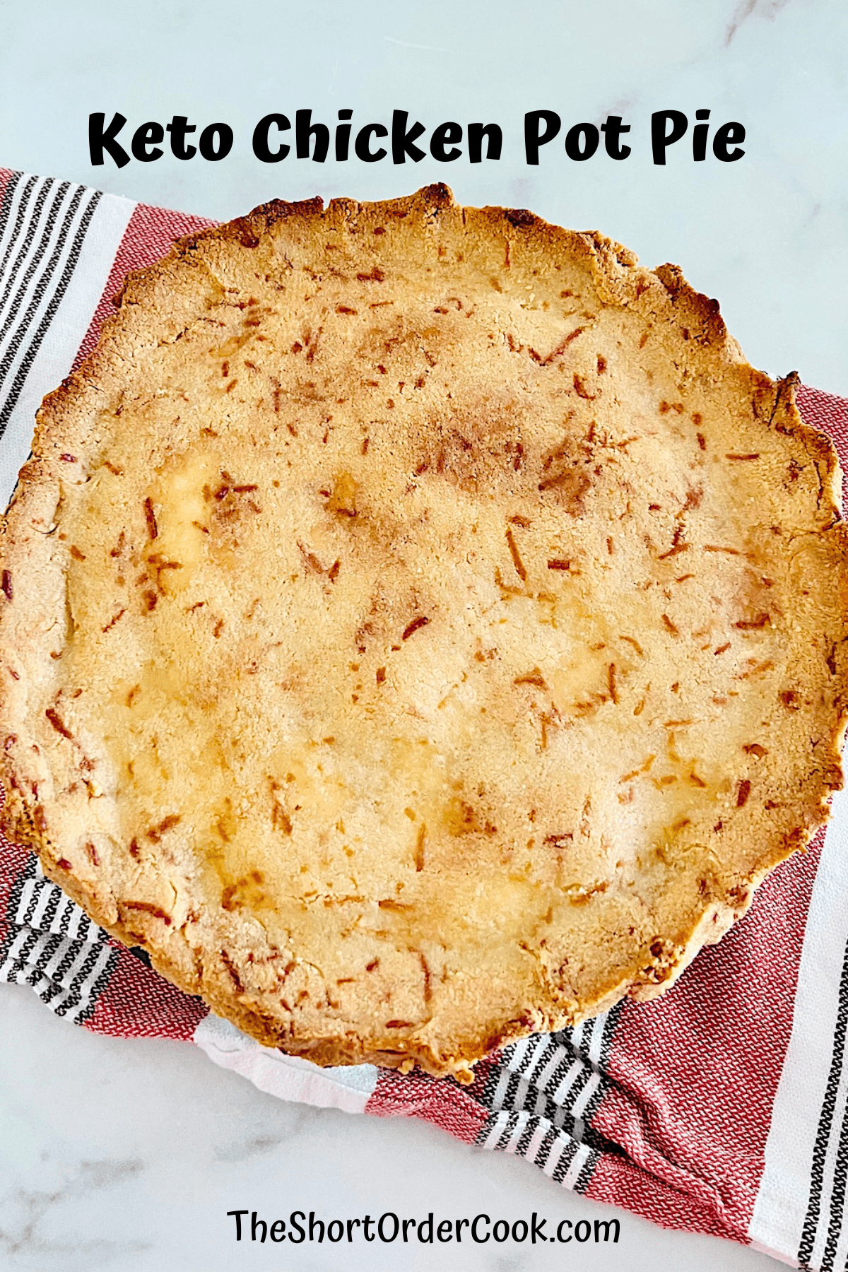 Whole pot pie made with keto crust and shredded chicken and vegetable filling.