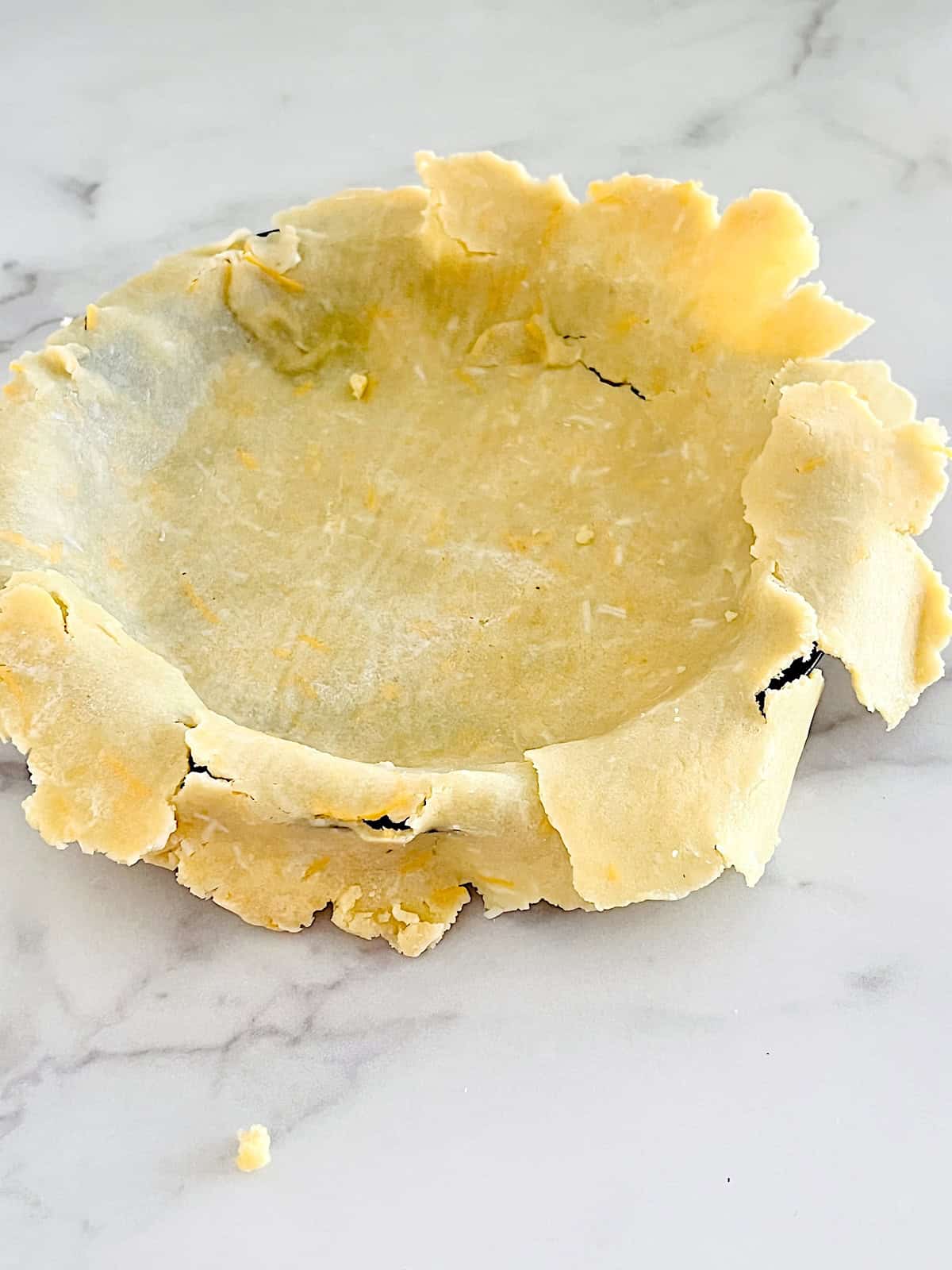 Savory Keto Pie Crust Assembling the crust in the pan.