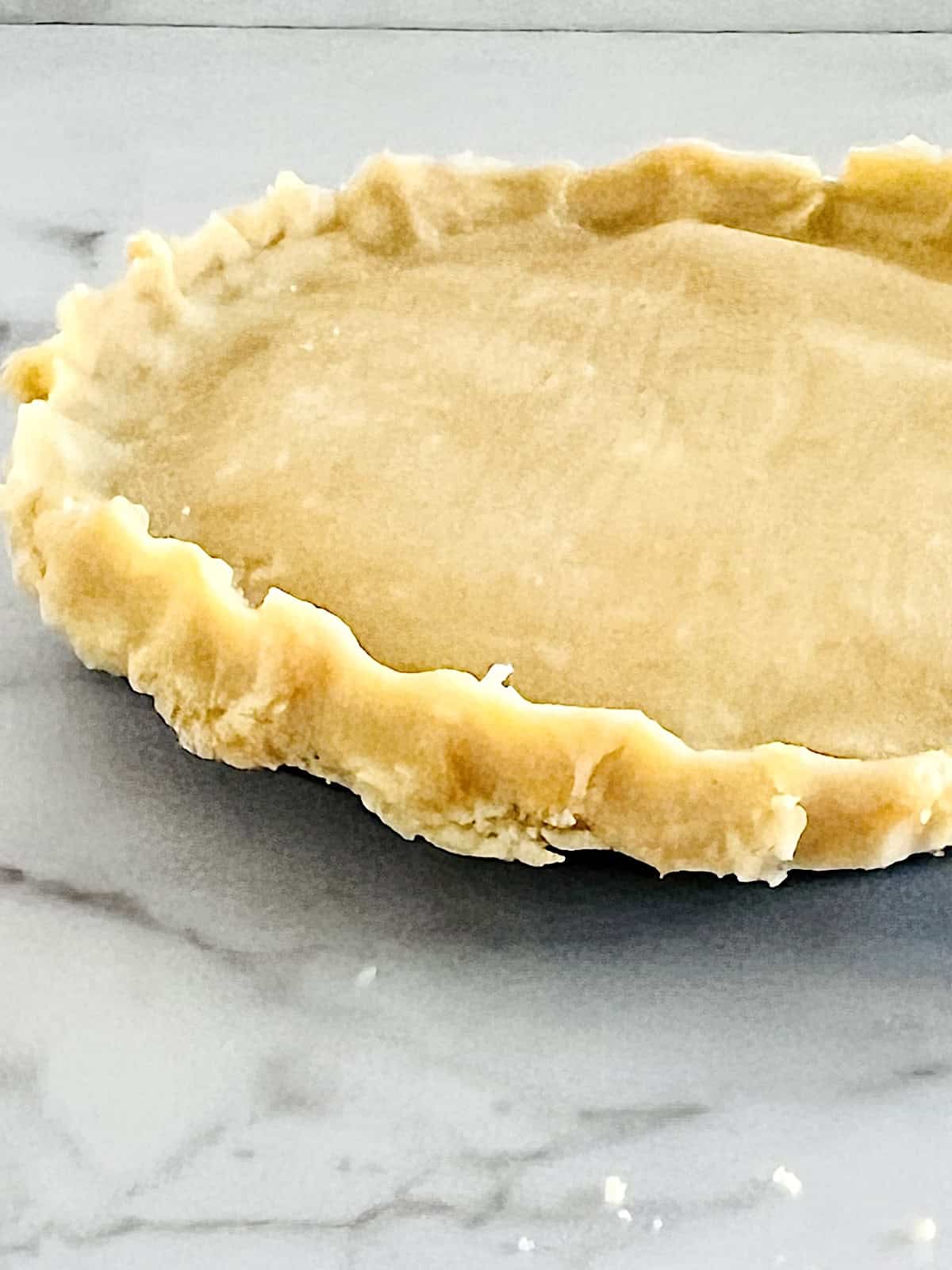 Savory Keto Pie Crust Top crust crimped over chicken pot pie filling.