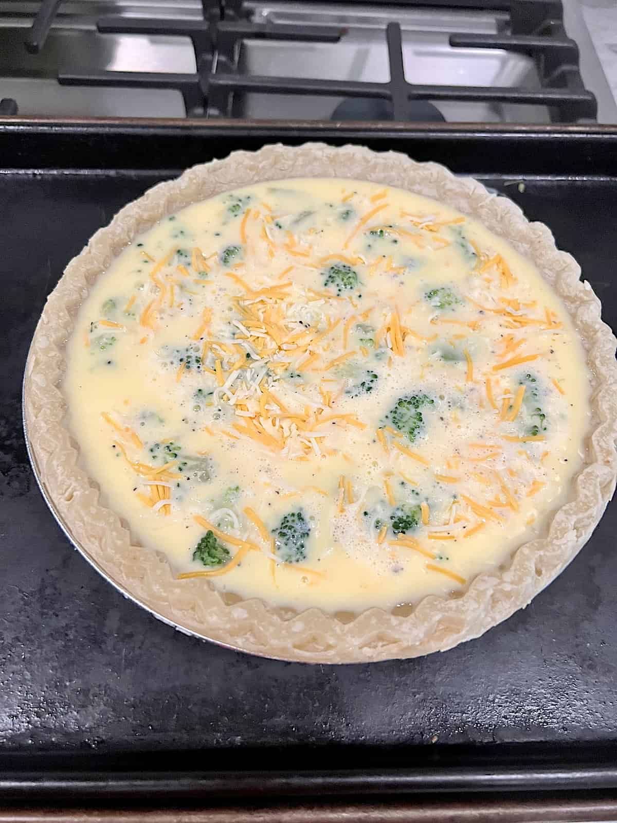 Broccoli Cheese Quiche Filled with egg custard florets and shredded cheest in crust.