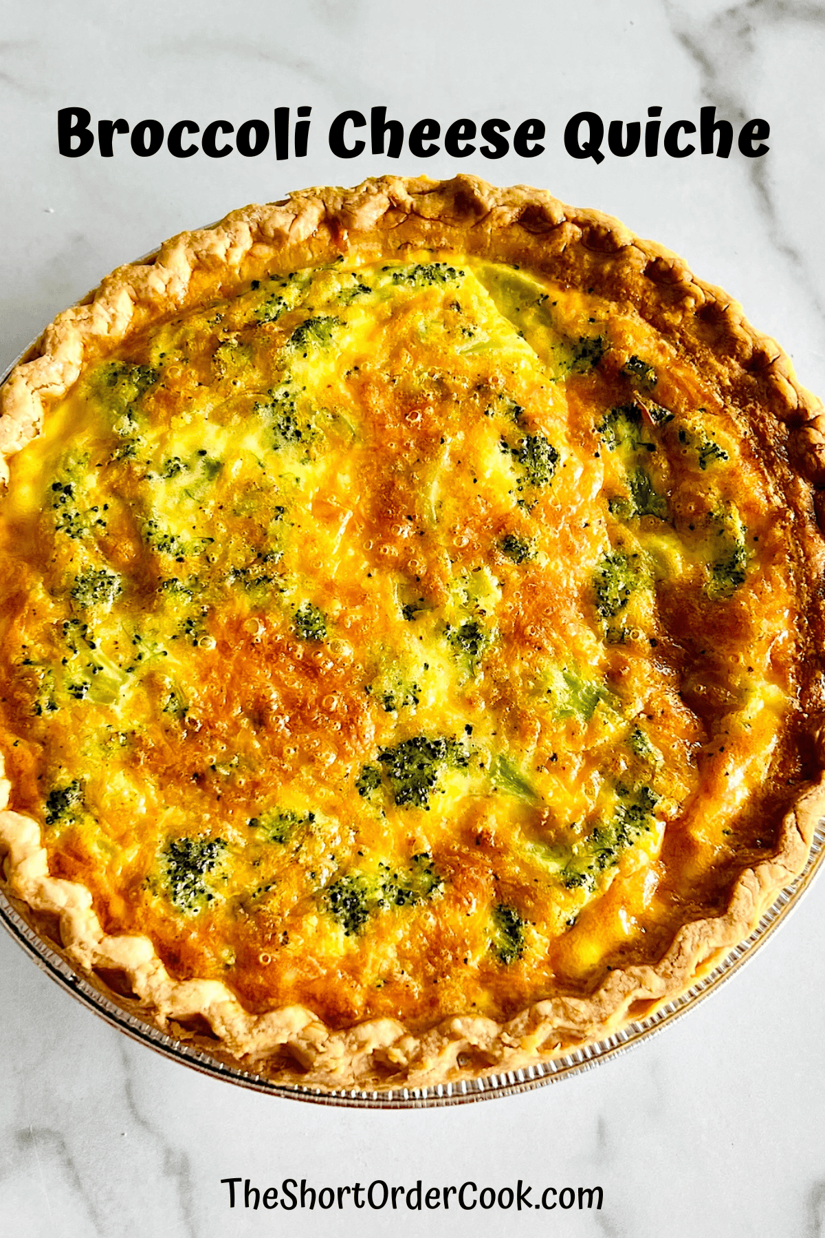 Whole Broccoli Cheese Quiche with flaky brown crust and golden top fresh from the oven.