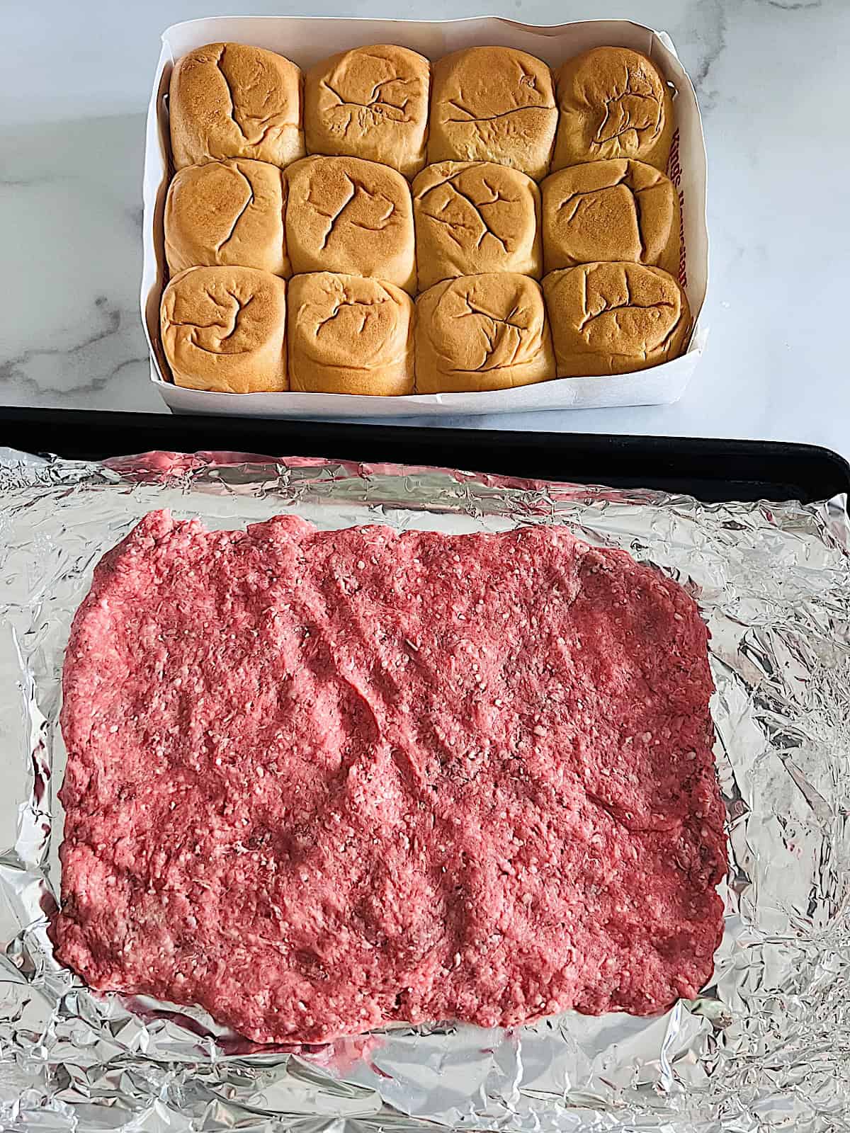 Cheeseburger Sliders Pressed ground beef in a rectangle next to box of slider rolls.