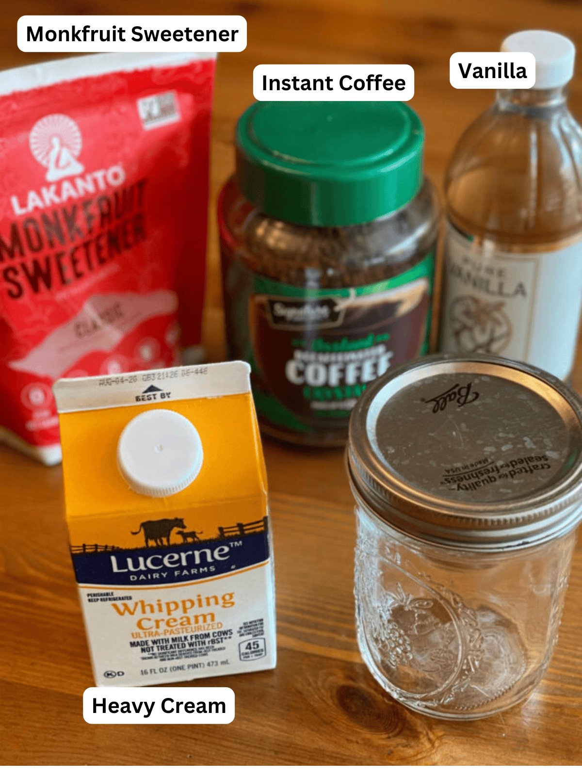 Keto Coffee Ice Cream Ingredients with Labels and mason jar on a table.