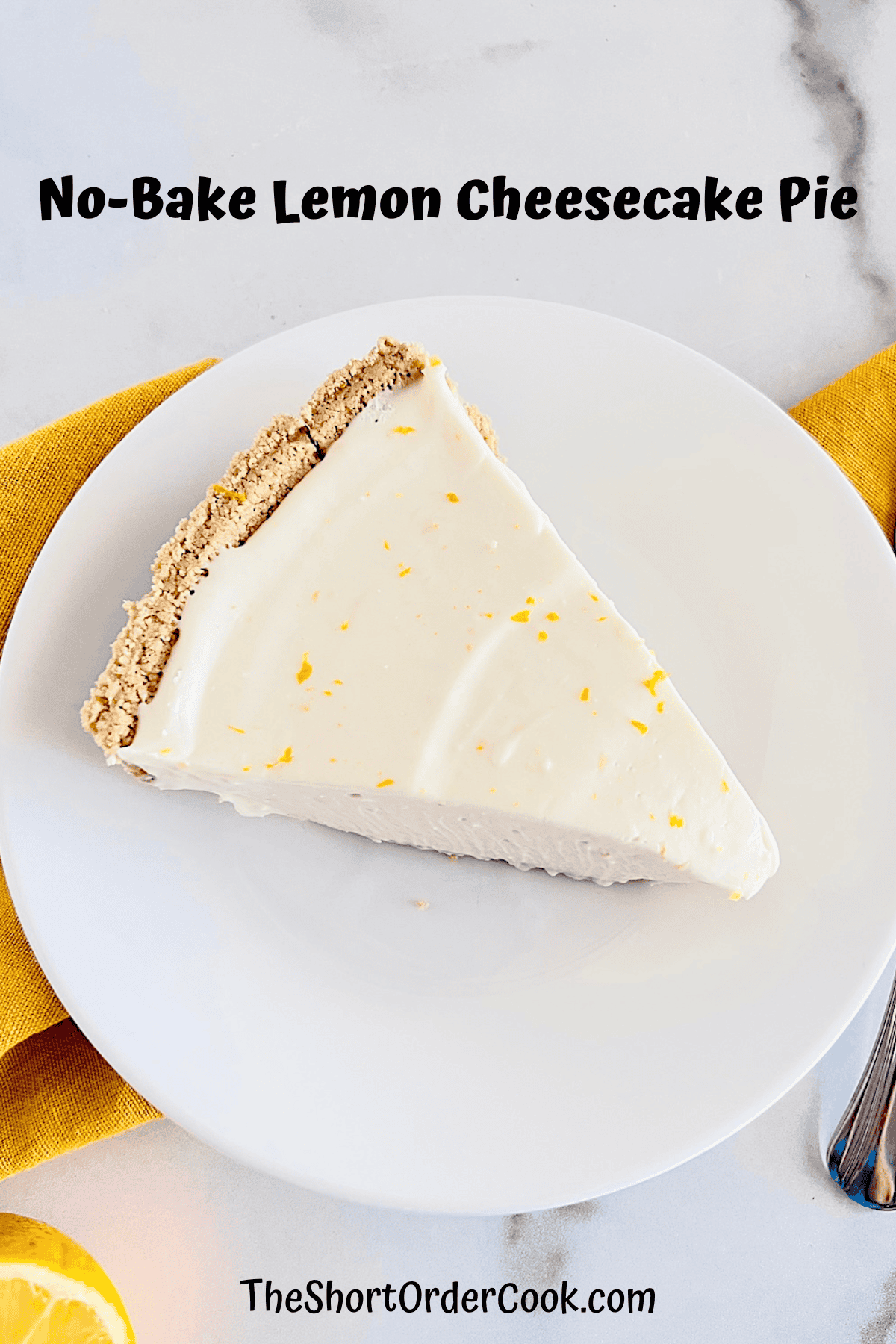 No-Bake Lemon Cheesecake Pie Slice removed from whole pie and plated
