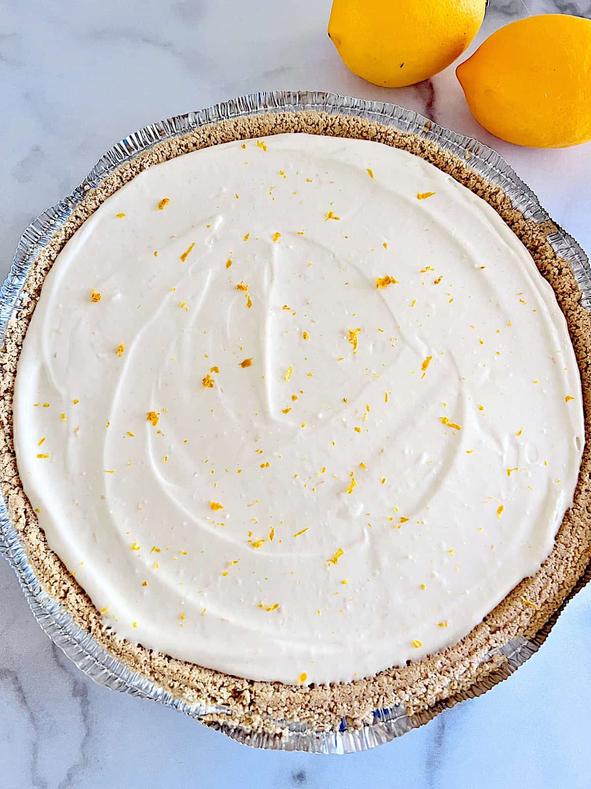 No-Bake Lemon Cheesecake Pie Set in the fridge and ready to cut and serve.